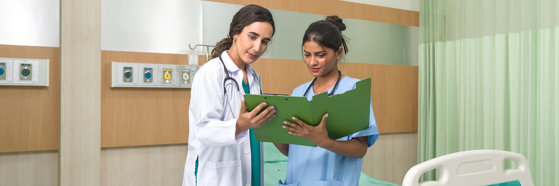 Young nurse in blue uniform informed the doctor of the patient examination schedule