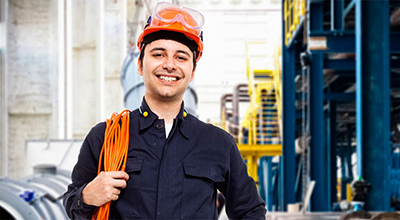 Electrician holding cables on his shoulder.