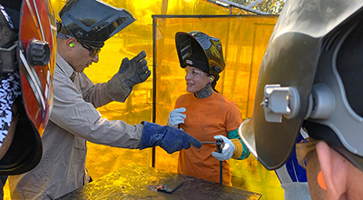 Welding montor with his student