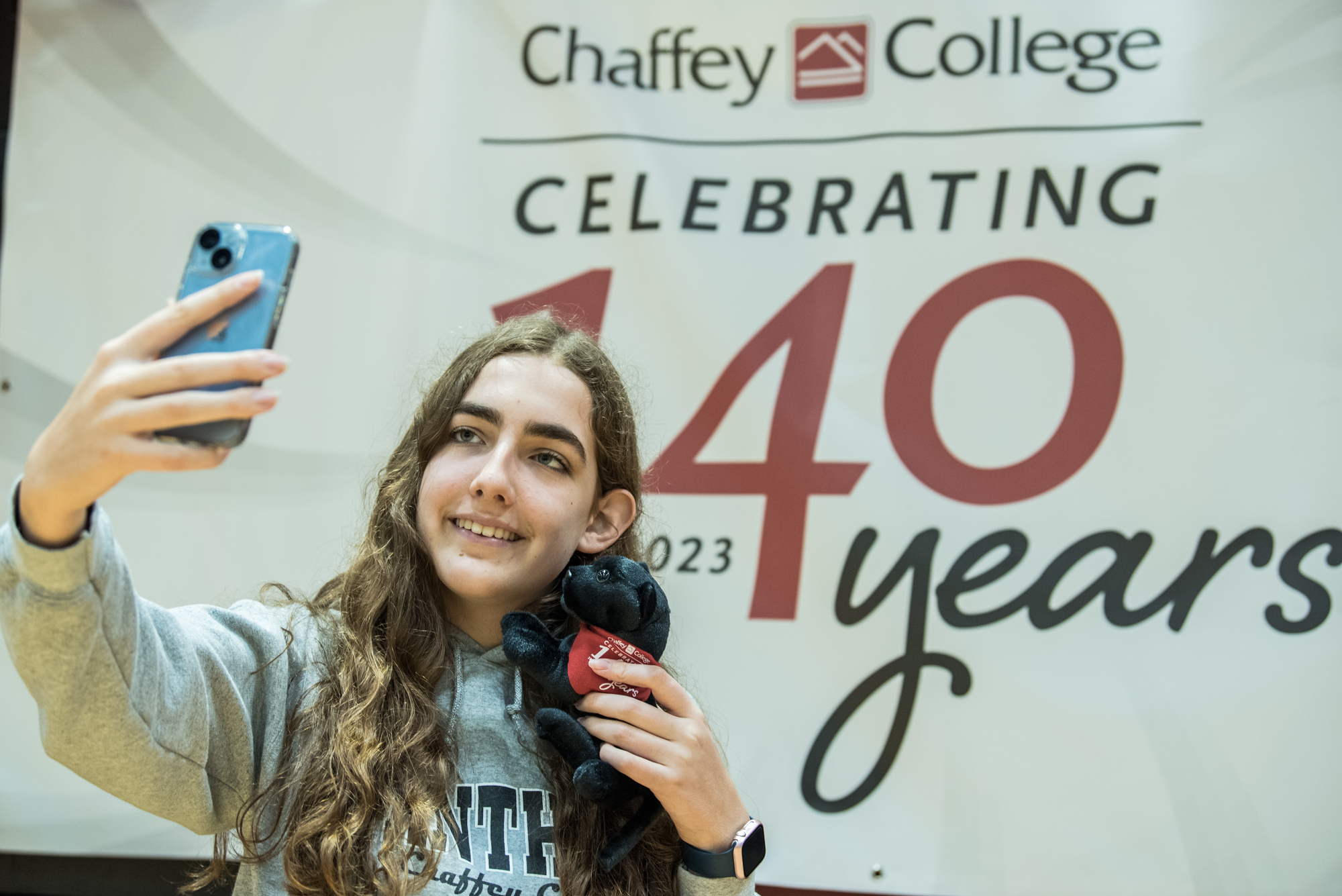 A girl takes a selfie at the Chaffey 140th anniversary celebration.