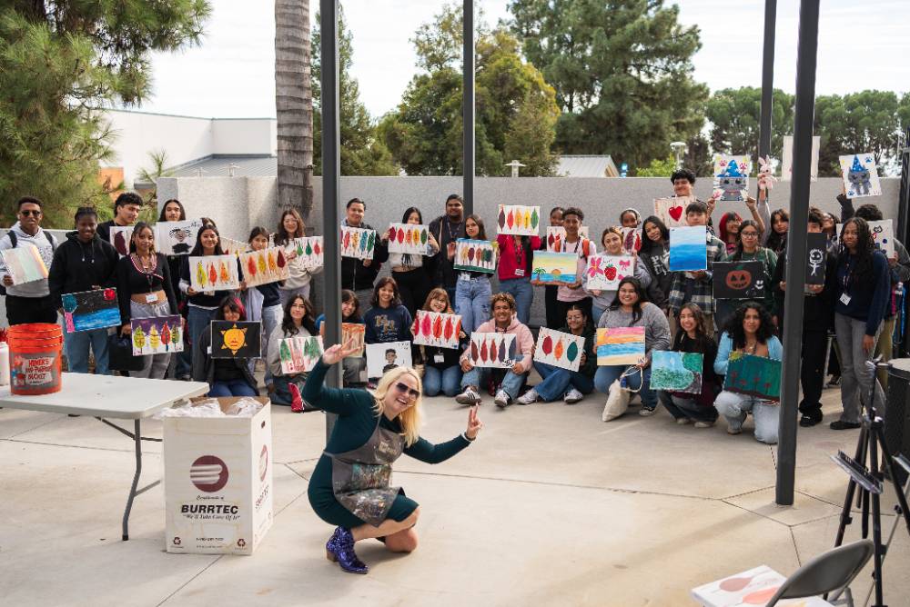 Students gather for a paint workshop at BBMM