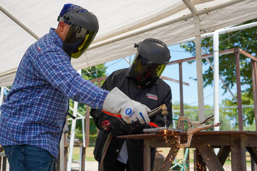 Alejandra Castillo participates in a welding demonstration.