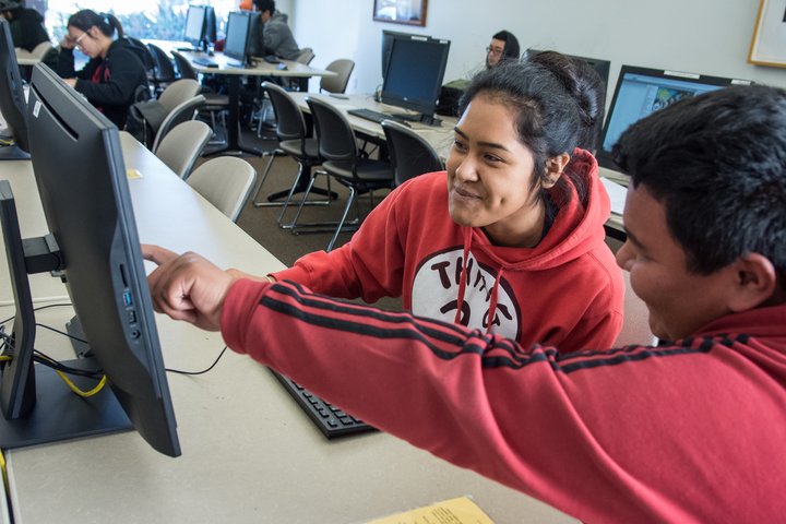 A student works on a laptop at the Chino campus.